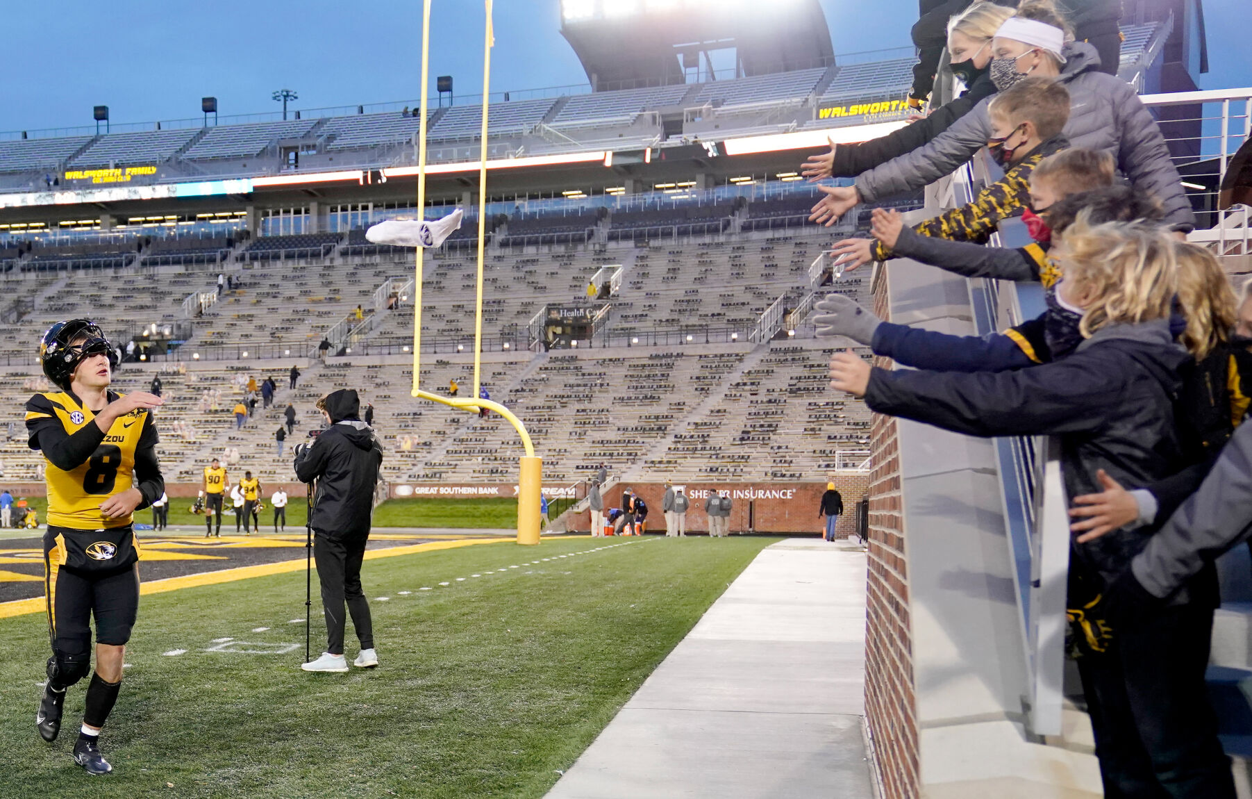 Connor Bazelak tosses a souvenir to fans